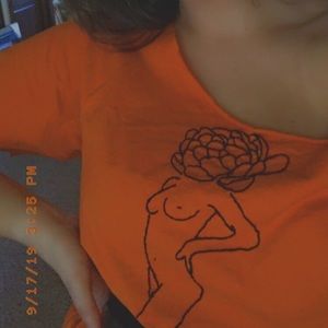 Orange shirt with cut neckline
